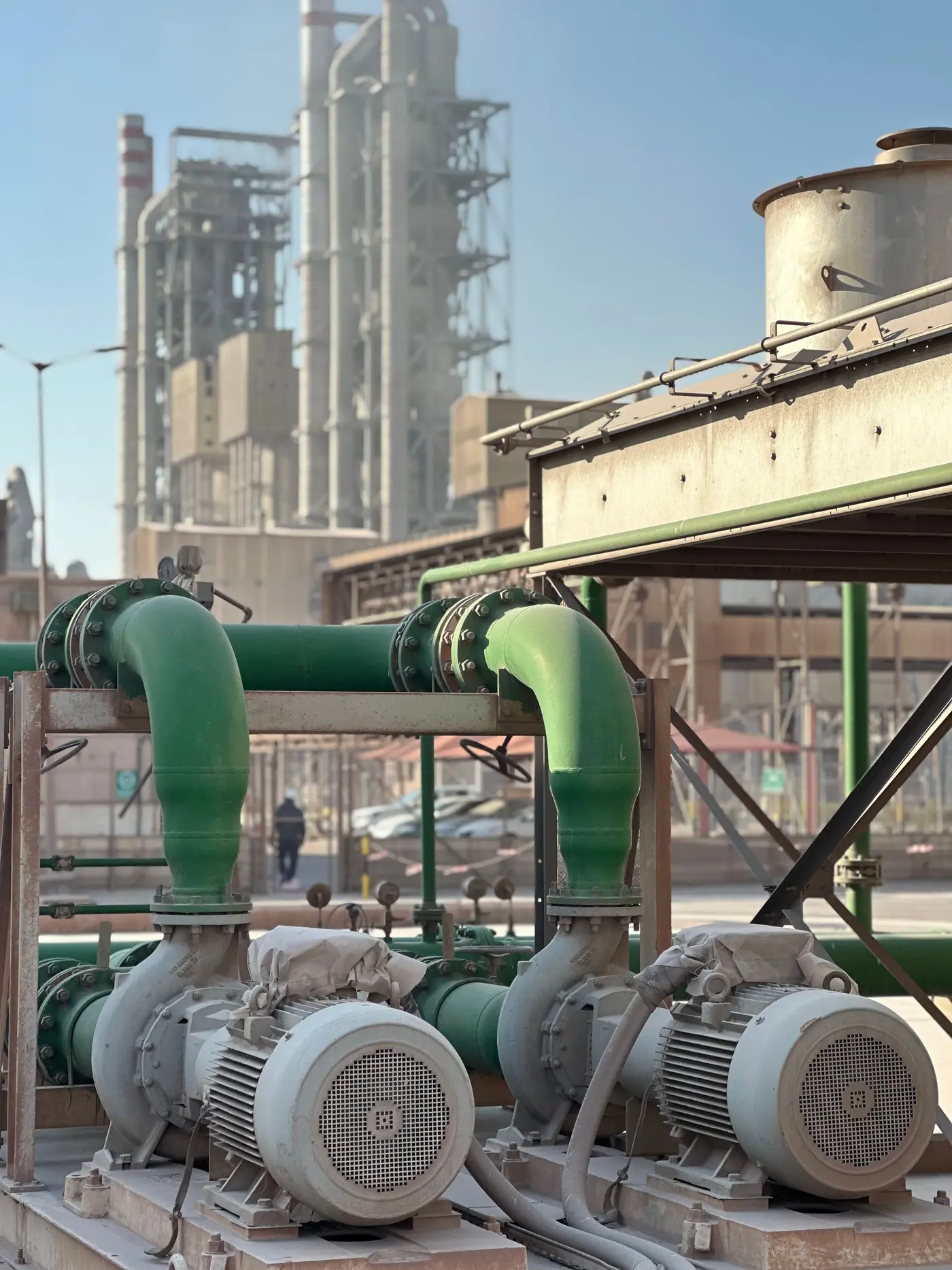 Bank of water pump units with electric motors and connected piping